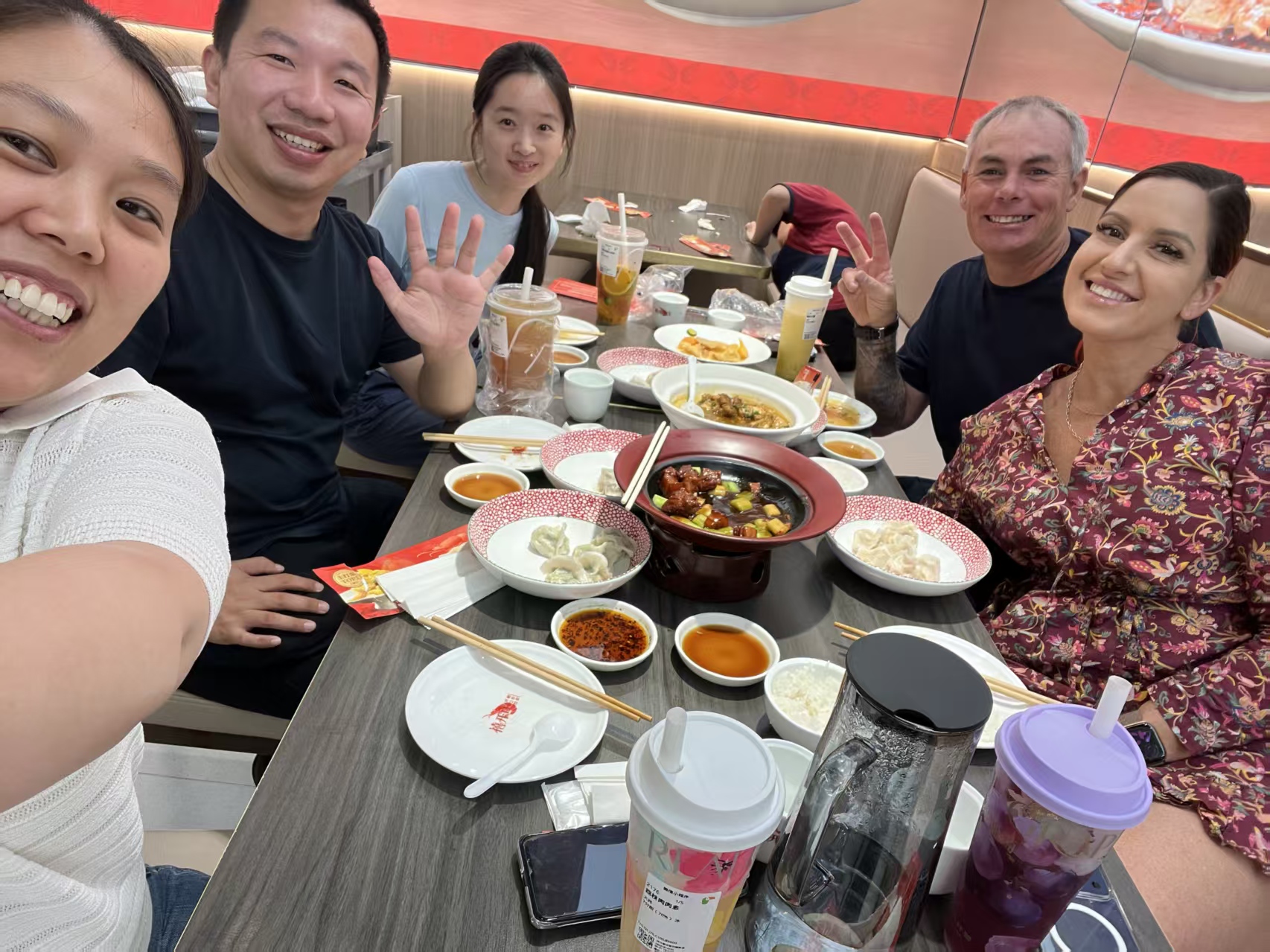 Feeker team and international customers sharing a meal after a factory visit