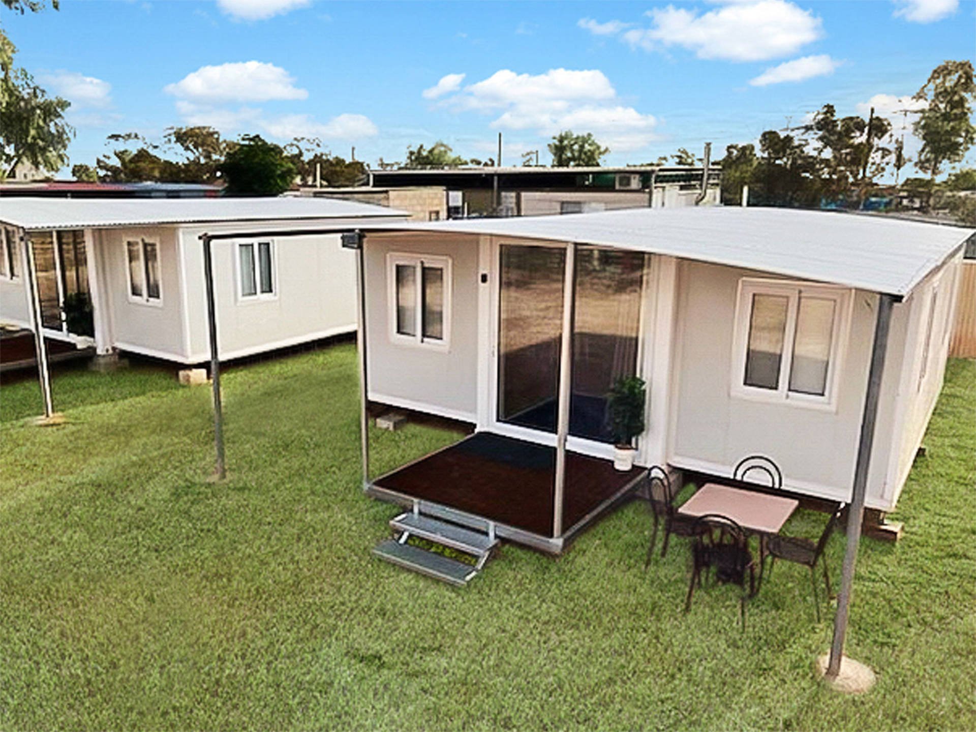 Expandable container house with wood-look exterior installed on site