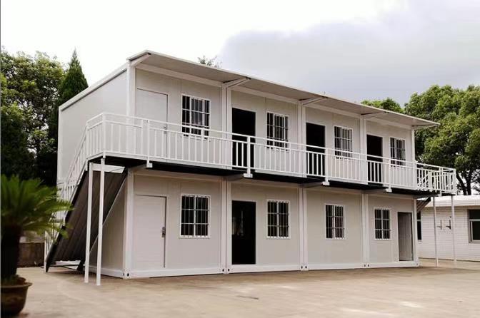 Flat pack container house with white exterior under blue sky